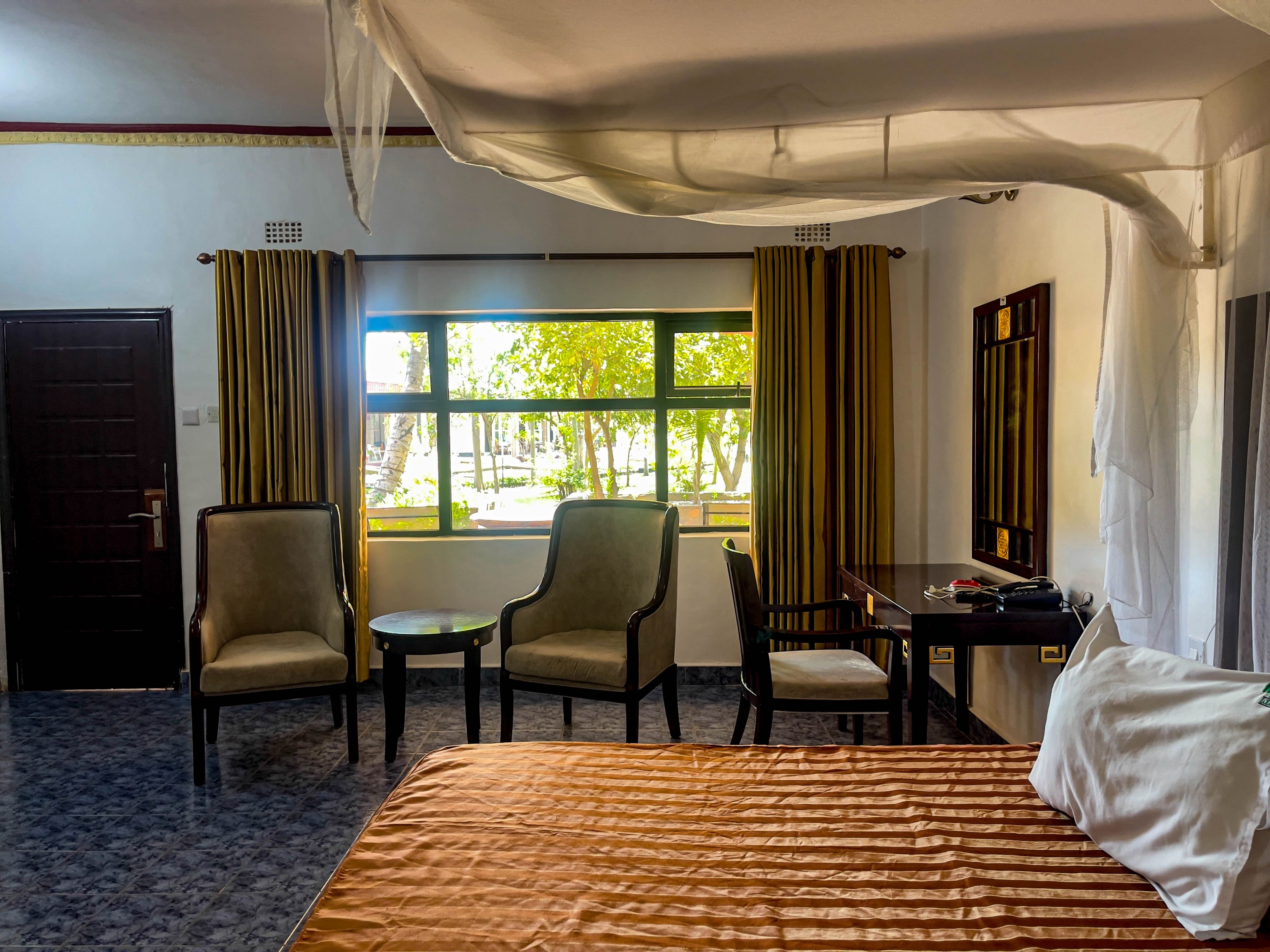 outside view of room with 2 chairs and room number 231
