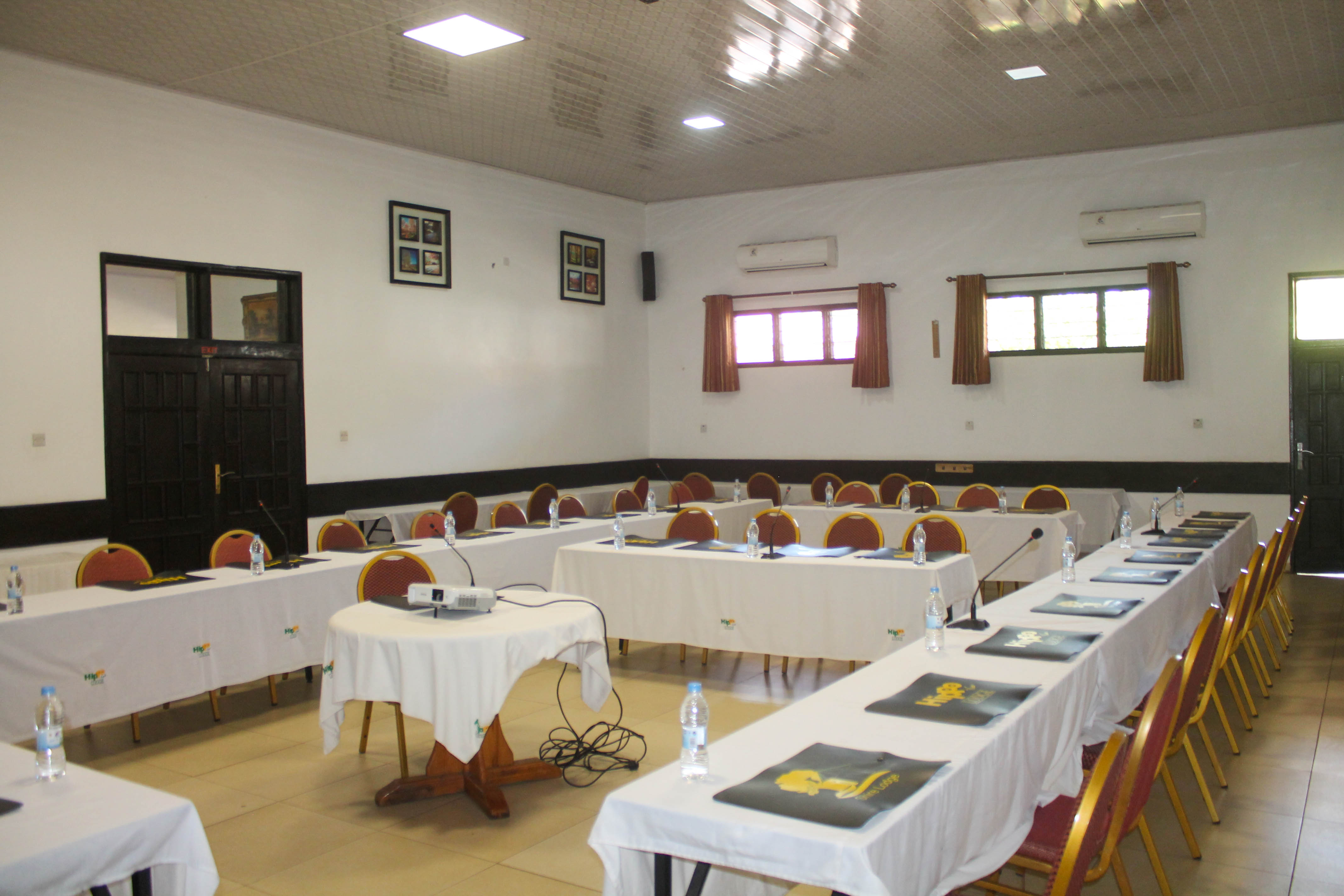 front view of njobvu hall entrance with sign and red chairs